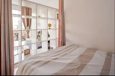 Un ou plusieurs lits dans un hébergement de l'établissement appartement magnifique et confortable