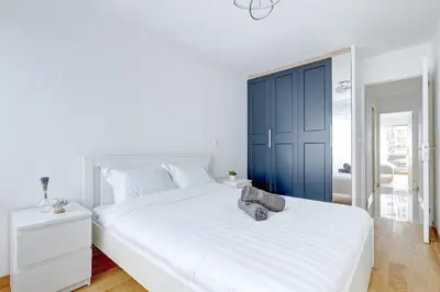 Un ou plusieurs lits dans un hébergement de l'établissement Suite au Cœur de Paris, Architecturale et Élégante
