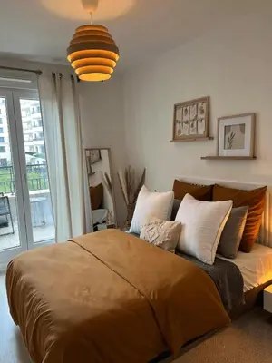 Un ou plusieurs lits dans un hébergement de l'établissement Modern apartment with terrace