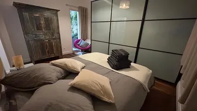 Un ou plusieurs lits dans un hébergement de l'établissement Grand Appartement Avec Patio à Paris 14ème