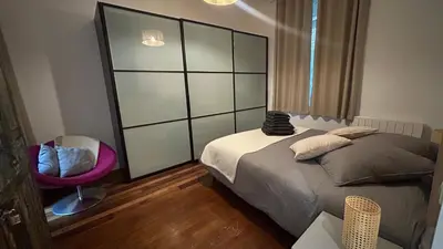 Un ou plusieurs lits dans un hébergement de l'établissement Grand Appartement Avec Patio à Paris 14ème