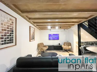 Coin salon dans l'établissement Urban Flat 09 - Stylish Triplex Champs-Elysees