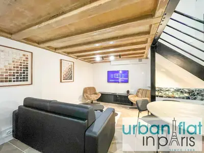 Coin salon dans l'établissement Urban Flat 09 - Stylish Triplex Champs-Elysees