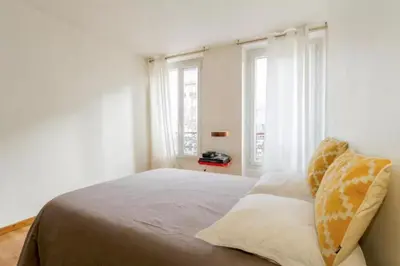 Un ou plusieurs lits dans un hébergement de l'établissement Appartement Paris Centre Vavin2