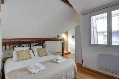Un ou plusieurs lits dans un hébergement de l'établissement Loft place des Vosges