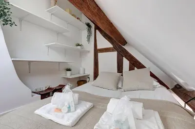 Un ou plusieurs lits dans un hébergement de l'établissement Loft place des Vosges
