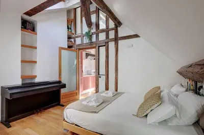 Un ou plusieurs lits dans un hébergement de l'établissement Loft place des Vosges