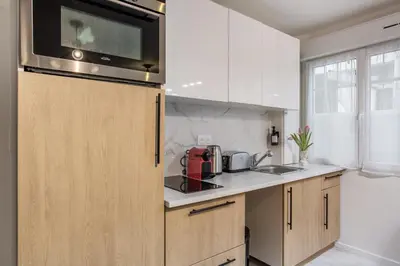 Cuisine ou kitchenette dans l'établissement L'Escapade Bastille - Appartement proche Marais