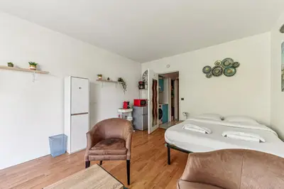 Un ou plusieurs lits dans un hébergement de l'établissement Chic studio Champs-élysées
