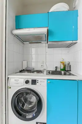 Cuisine ou kitchenette dans l'établissement Chic studio Champs-élysées