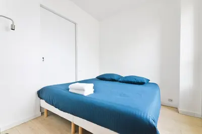 Un ou plusieurs lits dans un hébergement de l'établissement Appartement Quartier Tour Eiffel 5 Free Netflix