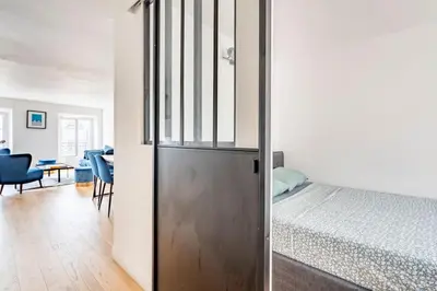 Un ou plusieurs lits dans un hébergement de l'établissement Apt moderne rénové et spacieux, au cœur de Paris