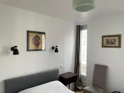 Un ou plusieurs lits dans un hébergement de l'établissement Beautiful and large apartment Paris Montparnasse