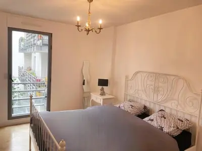 Un ou plusieurs lits dans un hébergement de l'établissement Beautiful and large apartment Paris Montparnasse