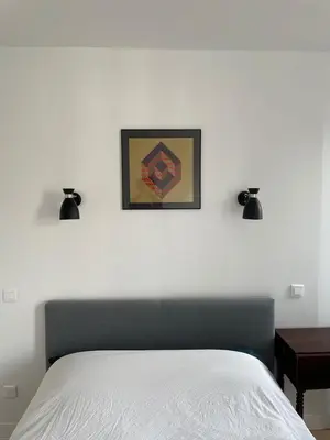 Un ou plusieurs lits dans un hébergement de l'établissement Beautiful and large apartment Paris Montparnasse