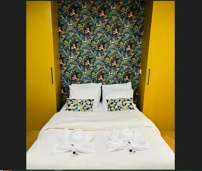 Un ou plusieurs lits dans un hébergement de l'établissement Appartement Paris 11 - 2 chambres - 2 sdd - 2 wc