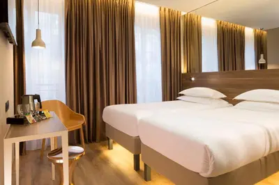 Un ou plusieurs lits dans un hébergement de l'établissement Cler Hotel