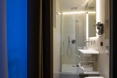 Salle de bains dans l'établissement Cler Hotel