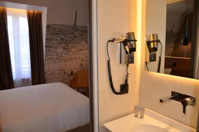 Un ou plusieurs lits dans un hébergement de l'établissement Cler Hotel
