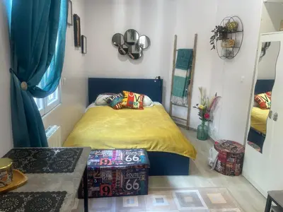 Un ou plusieurs lits dans un hébergement de l'établissement Cozy Studio