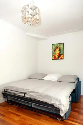 Un ou plusieurs lits dans un hébergement de l'établissement Charmant appartement - 4 couchages à proximité d'Opéra et des métros