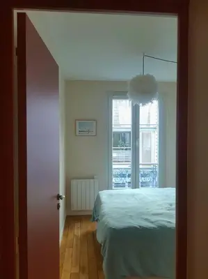Un ou plusieurs lits dans un hébergement de l'établissement Calme Séjour - Montmartre