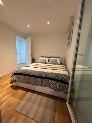 Un ou plusieurs lits dans un hébergement de l'établissement Cosy logement entier à Asnières sur Seine