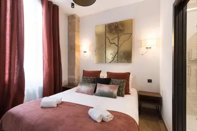 Un ou plusieurs lits dans un hébergement de l'établissement Republique Bastille Chic & Design Apartment 6P 2BR