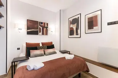 Un ou plusieurs lits dans un hébergement de l'établissement Republique Bastille Chic & Design Apartment 6P 2BR
