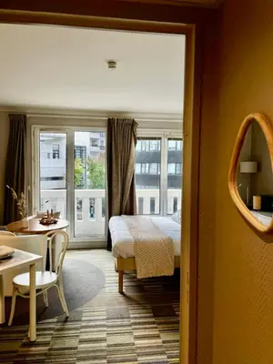 Un ou plusieurs lits dans un hébergement de l'établissement Paris Porte de Versailles Cosy Lodge 1 Appart hôtel parking wifi 4 pers