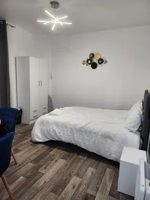 Un ou plusieurs lits dans un hébergement de l'établissement Studio proche Paris