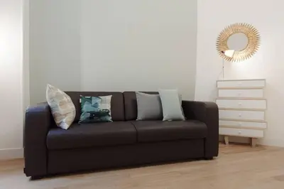 Coin salon dans l'établissement Appartement avec beaux volumes cœur du MARAIS