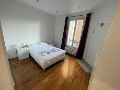 Un ou plusieurs lits dans un hébergement de l'établissement Appartement à Gentilly, à 2 pas de Paris