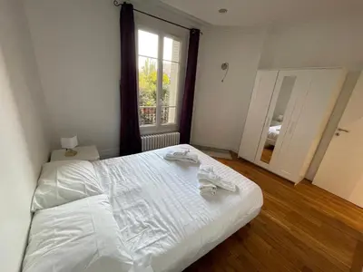 Un ou plusieurs lits dans un hébergement de l'établissement Appartement à Gentilly, à 2 pas de Paris