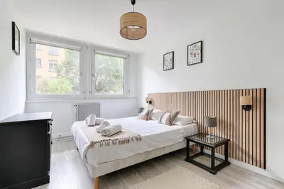 Un ou plusieurs lits dans un hébergement de l'établissement Beaugrenelle Tour Eiffel II Cosy Apartment 2BR