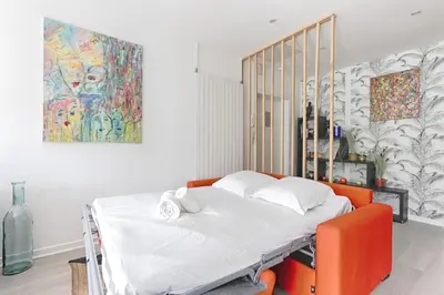 Un ou plusieurs lits dans un hébergement de l'établissement Beaugrenelle Tour Eiffel II Cosy Apartment 2BR
