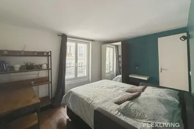 Un ou plusieurs lits dans un hébergement de l'établissement Flexliving - Studio - Martyrs