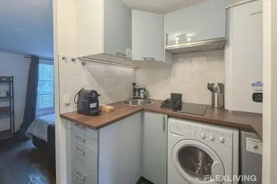 Cuisine ou kitchenette dans l'établissement Flexliving - Studio - Martyrs