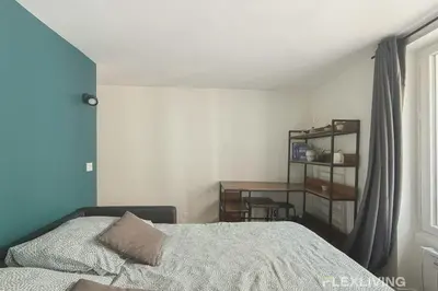 Un ou plusieurs lits dans un hébergement de l'établissement Flexliving - Studio - Martyrs