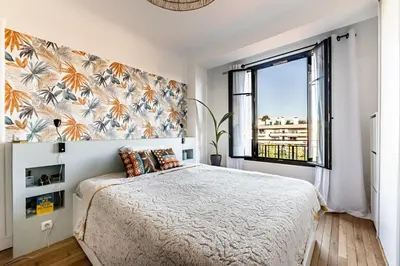 Un ou plusieurs lits dans un hébergement de l'établissement Charmant Appartement Boulogne - 1 chambre