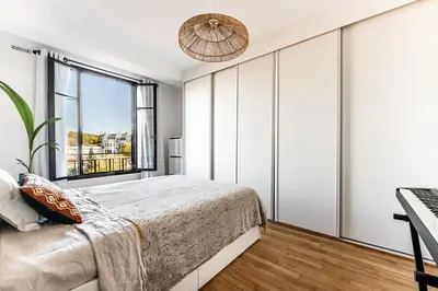 Un ou plusieurs lits dans un hébergement de l'établissement Charmant Appartement Boulogne - 1 chambre