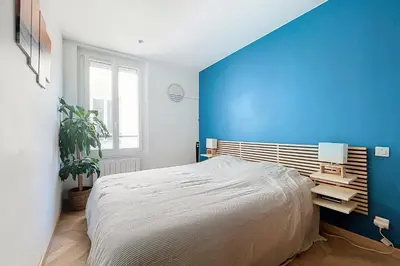 Un ou plusieurs lits dans un hébergement de l'établissement Charming 2-Room Paris Getaway Near Le Marais