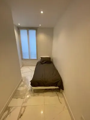 Un ou plusieurs lits dans un hébergement de l'établissement Appartement au rez de chaussée pres de gare de lyon