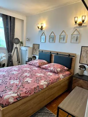 Un ou plusieurs lits dans un hébergement de l'établissement Appartement Standing Paris