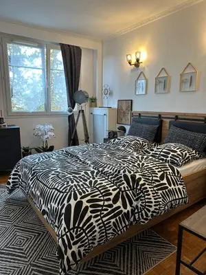 Un ou plusieurs lits dans un hébergement de l'établissement Appartement Standing Paris