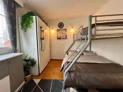 Un ou plusieurs lits dans un hébergement de l'établissement Appartement Standing Paris