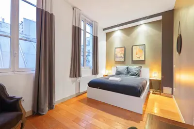 Un ou plusieurs lits dans un hébergement de l'établissement Appartement Quartier Palais Garnier Free Netflix
