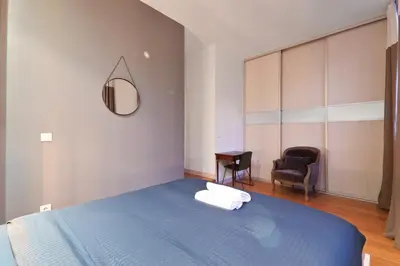 Un ou plusieurs lits dans un hébergement de l'établissement Appartement Quartier Palais Garnier Free Netflix