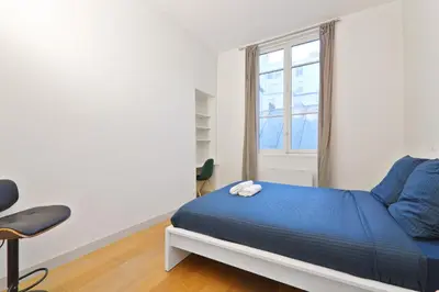 Un ou plusieurs lits dans un hébergement de l'établissement Appartement Quartier Palais Garnier Free Netflix