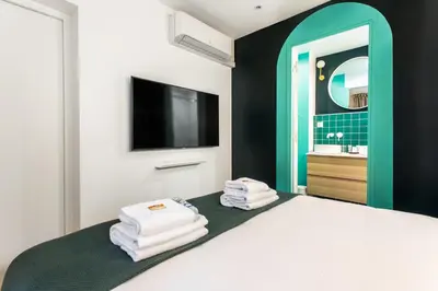 Un ou plusieurs lits dans un hébergement de l'établissement Stunning apartment - 2BR-6P - Paris Center